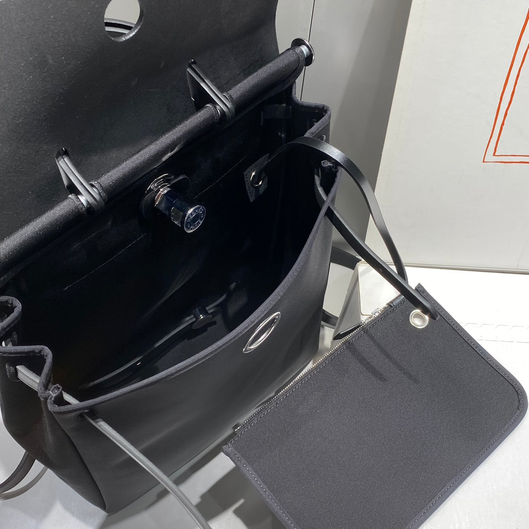 HERMES HERBAG A DOS ZIP RETOURNE BACKPACK 29 IN BLACK CANVAS AND CALFSKIN