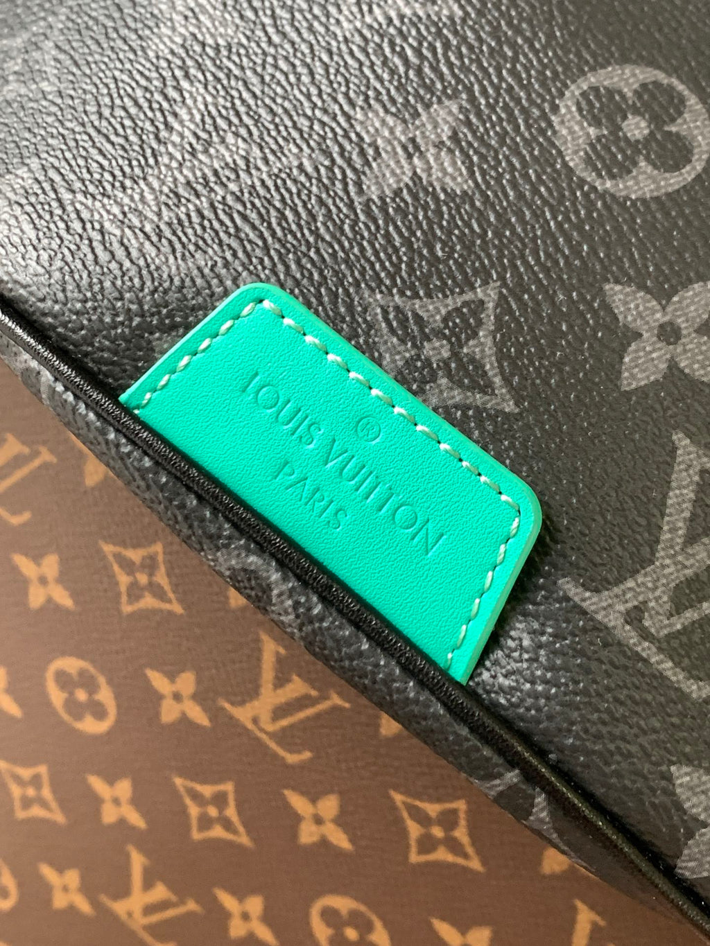 LOUIS VUITTON LV 25S DISCOVERY BUMBAG 44 IN BLACK AQUA MONOGRAM ECLIPSE CANVAS AND CALFSKIN