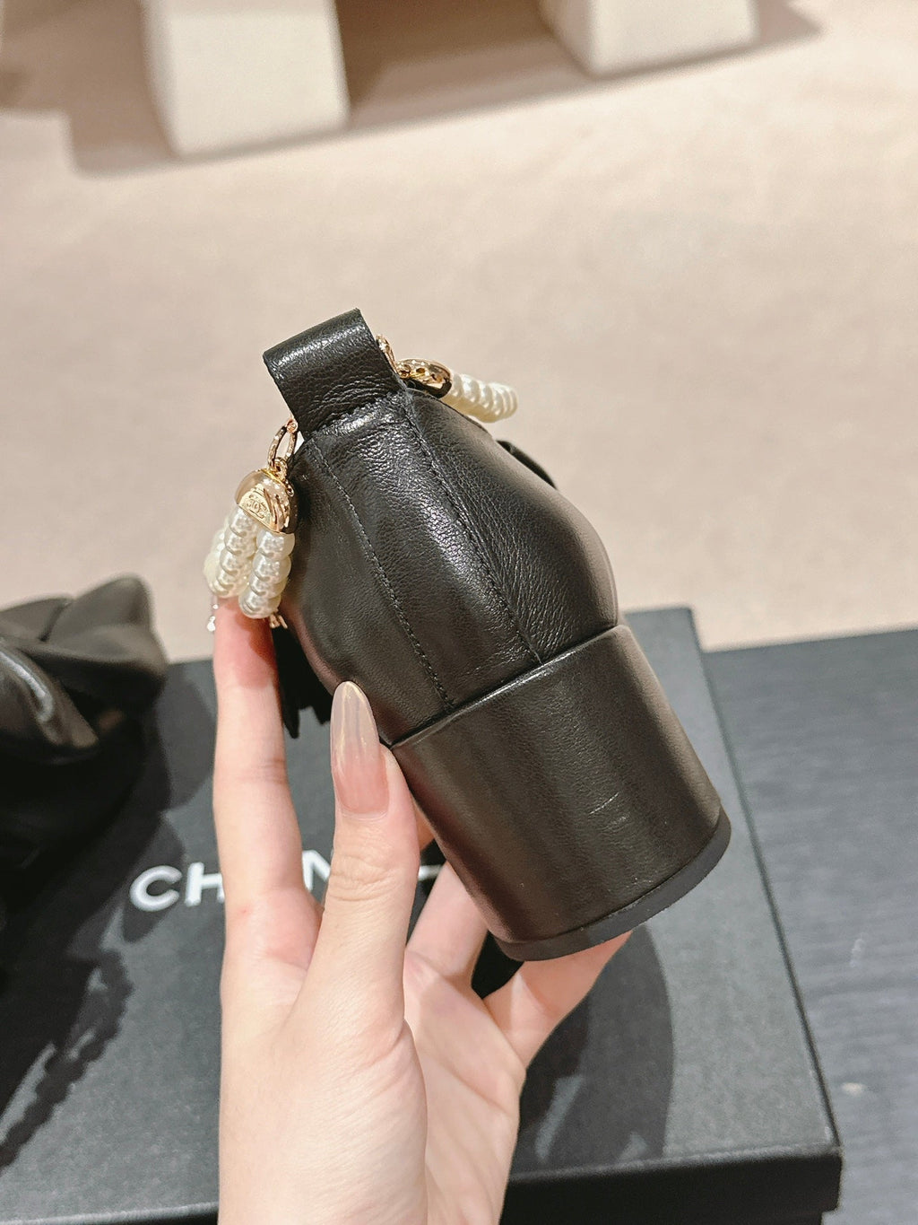 CHANEL SHORT BOOTS IN BLACK SHEEPSKIN WITH BOW