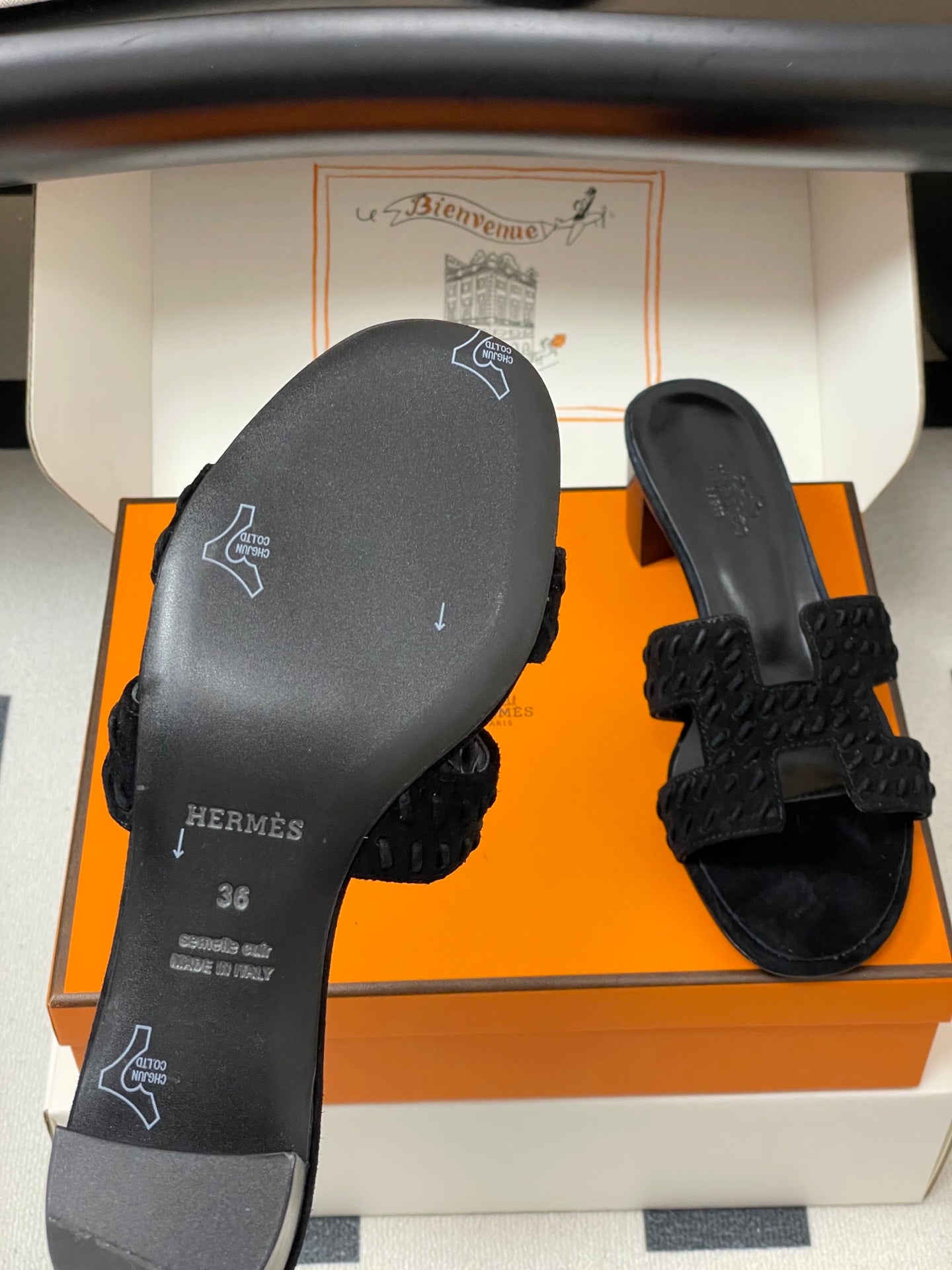 HERMES 25S ORAN HIGH‑HEEL SANDAL IN BLACK SUEDE AND LAMBSKIN